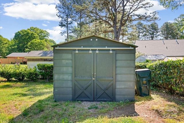 view of shed with fence