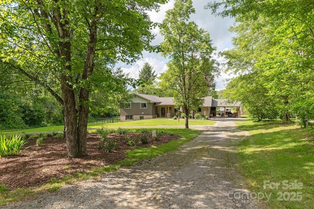 4329 Island Ford Rd, Brevard, NC 28712 - tri-level home featuring a front yard and dirt driveway