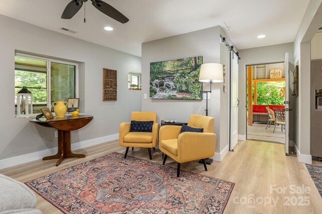 4329 Island Ford Rd, Brevard, NC 28712 - living area with a barn door, ceiling fan, light wood-style floors, baseboards, and recessed lighting