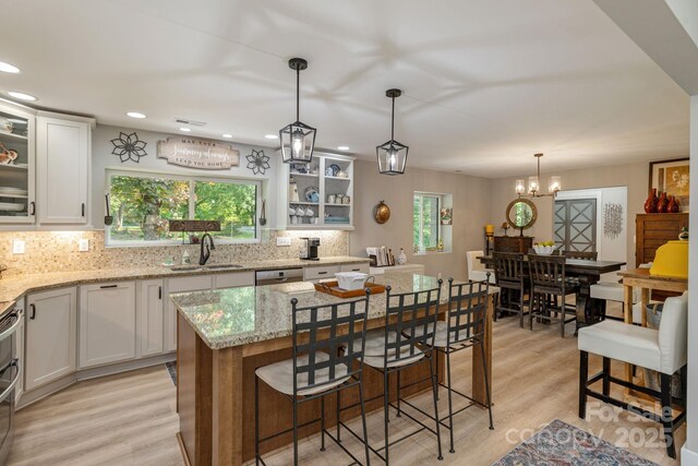 4329 Island Ford Rd, Brevard, NC 28712 - kitchen with a sink, backsplash, white cabinetry, light wood-style floors, and dishwasher