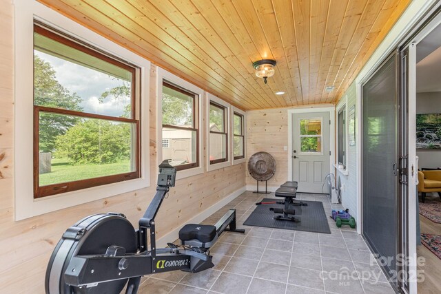 4329 Island Ford Rd, Brevard, NC 28712 - workout area featuring wood ceiling, tile patterned flooring, and wooden walls