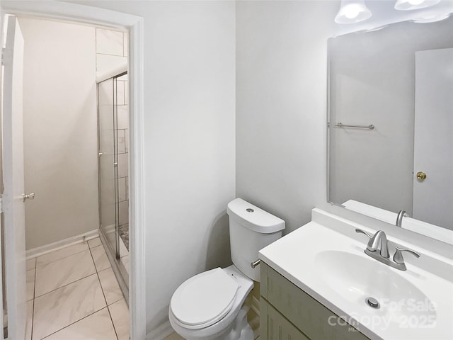 full bathroom with vanity, baseboards, toilet, and a shower stall