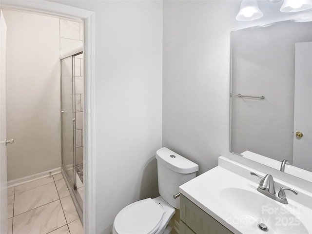 full bath featuring toilet, a shower stall, and vanity
