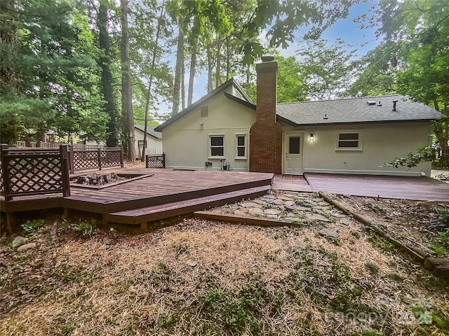 rear view of property with a chimney