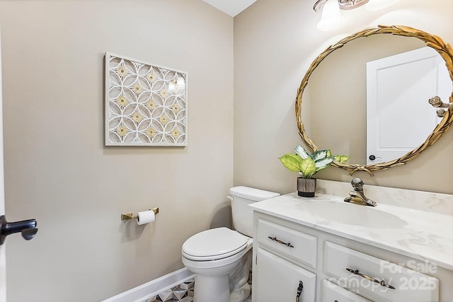 115 Forestcliff Ct NE, Concord, NC 28025 - bathroom with toilet, vanity, and baseboards