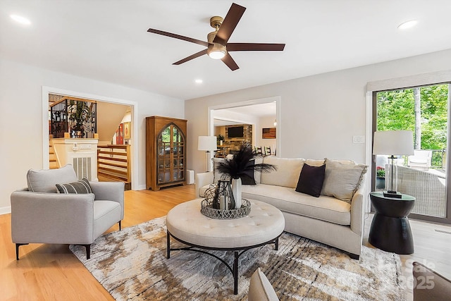 115 Forestcliff Ct NE, Concord, NC 28025 - living area with stairs, light wood finished floors, a ceiling fan, and recessed lighting