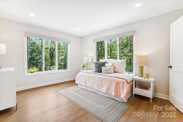 115 Forestcliff Ct NE, Concord, NC 28025 - bedroom with wood finished floors, baseboards, and recessed lighting
