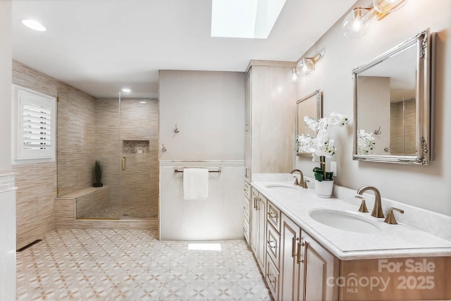 115 Forestcliff Ct NE, Concord, NC 28025 - full bath featuring a skylight, a stall shower, double vanity, tile walls, and recessed lighting