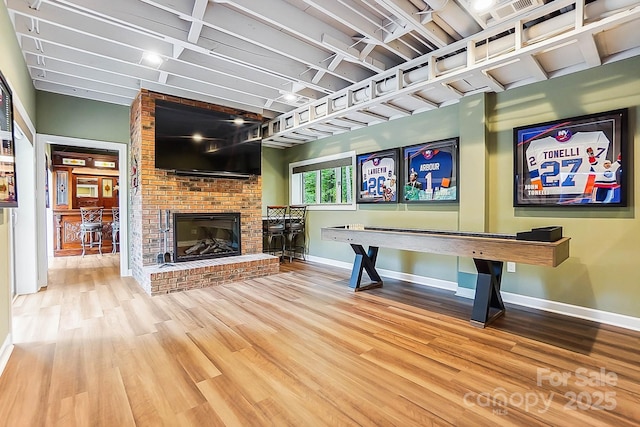 115 Forestcliff Ct NE, Concord, NC 28025 - rec room featuring wood finished floors, baseboards, and a fireplace