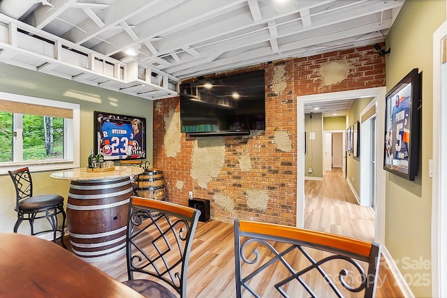 115 Forestcliff Ct NE, Concord, NC 28025 - indoor dry bar with wood finished floors, brick wall, and baseboards