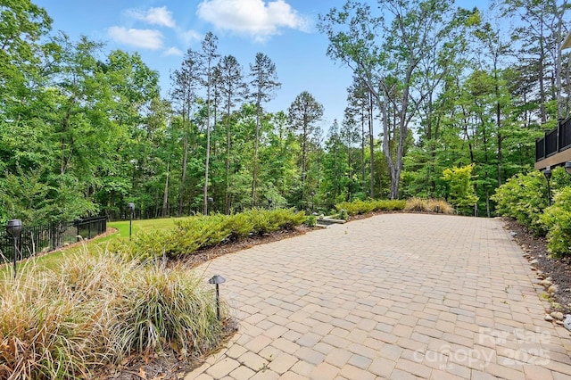 115 Forestcliff Ct NE, Concord, NC 28025 - view of property's community featuring a patio area and fence