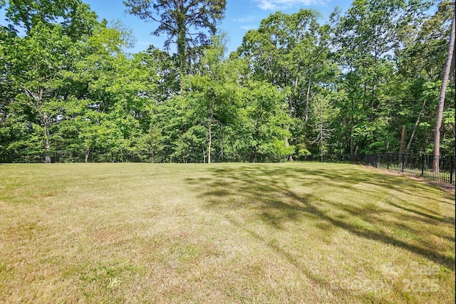 115 Forestcliff Ct NE, Concord, NC 28025 - view of yard featuring a view of trees