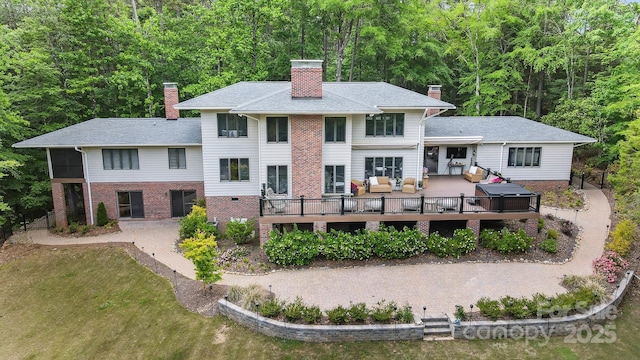 115 Forestcliff Ct NE, Concord, NC 28025 - back of property featuring an outdoor hangout area, a chimney, a deck, brick siding, and a forest view
