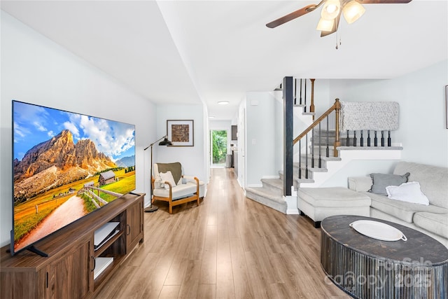 9214 N Vicksburg Park Ct, Charlotte, NC 28210 - living room with stairs, a ceiling fan, and light wood-type flooring