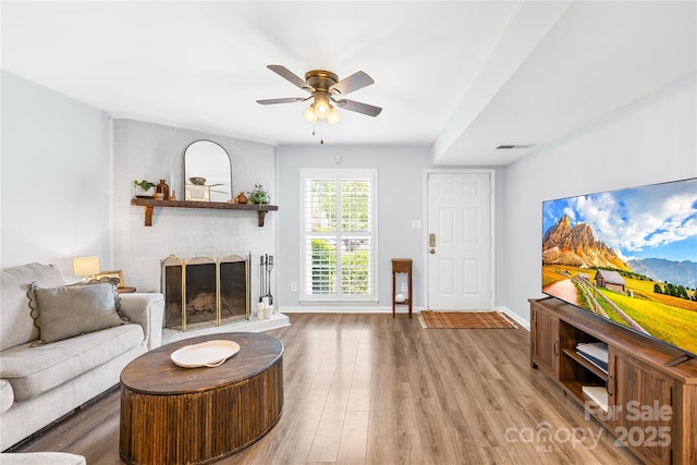 9214 N Vicksburg Park Ct, Charlotte, NC 28210 - living area featuring a ceiling fan, baseboards, wood finished floors, and a fireplace