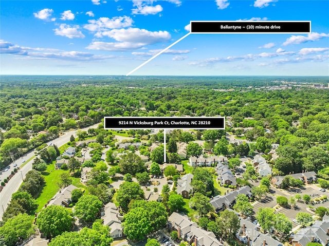 9214 N Vicksburg Park Ct, Charlotte, NC 28210 - drone / aerial view with a residential view and a wooded view
