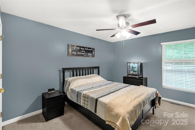 bedroom featuring carpet floors, baseboards, and visible vents