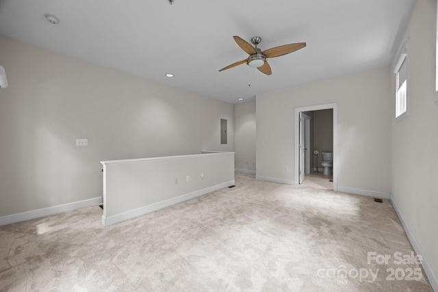 625 N Alexander St, Charlotte, NC 28202 - spare room with a ceiling fan, light colored carpet, baseboards, a smoke detector, and electric panel