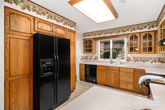 1152 Bent Tree Dr Unit F2Garage, Hendersonville, NC 28739 - kitchen with black appliances, a sink, brown cabinetry, and glass insert cabinets
