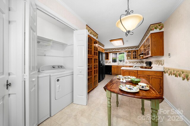 1152 Bent Tree Dr Unit F2Garage, Hendersonville, NC 28739 - laundry room with washer and clothes dryer, wallpapered walls, and ornamental molding