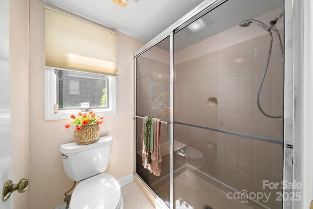 1152 Bent Tree Dr Unit F2Garage, Hendersonville, NC 28739 - full bathroom with toilet, a shower stall, baseboards, and tile patterned floors
