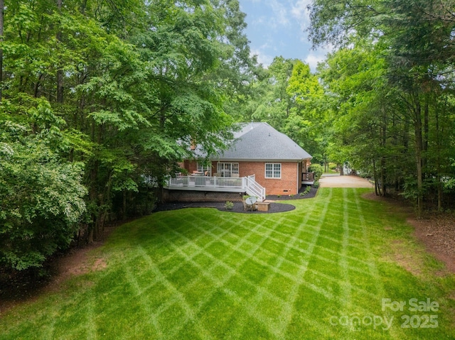 view of yard featuring a wooden deck