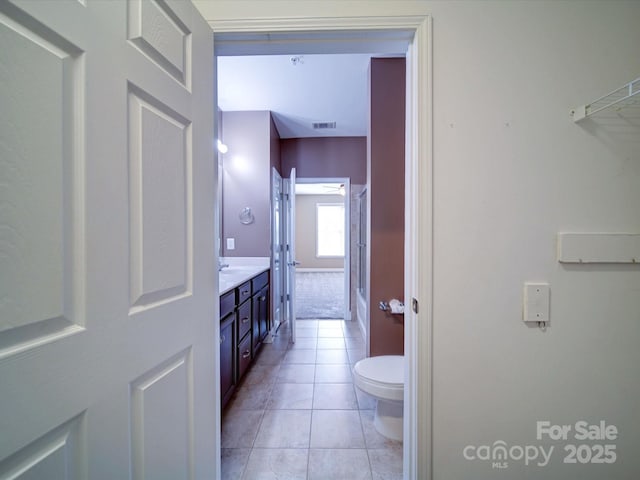 1000 E Woodlawn Rd Unit 402, Charlotte, NC 28209 - full bath featuring visible vents, tile patterned flooring, vanity, toilet, and shower / bathtub combination