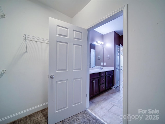1000 E Woodlawn Rd Unit 402, Charlotte, NC 28209 - bathroom featuring vanity and baseboards