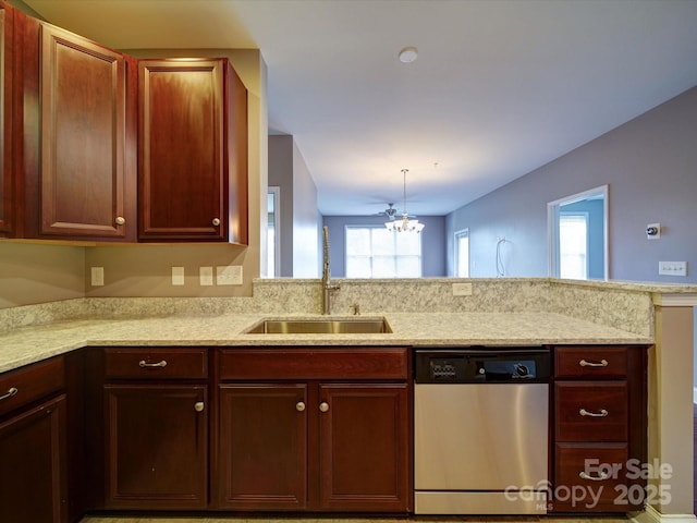 1000 E Woodlawn Rd Unit 402, Charlotte, NC 28209 - kitchen featuring light stone counters, plenty of natural light, a sink, and dishwasher