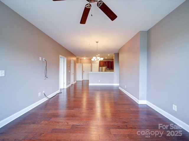 1000 E Woodlawn Rd Unit 402, Charlotte, NC 28209 - interior space featuring baseboards, dark wood-style floors, and ceiling fan with notable chandelier