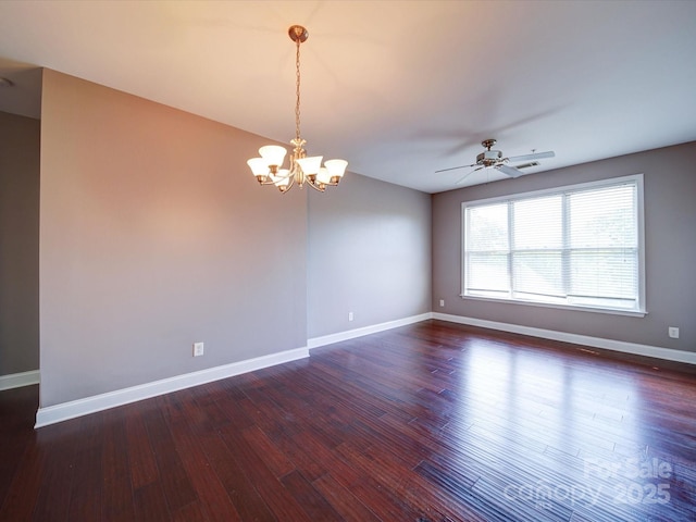 1000 E Woodlawn Rd Unit 402, Charlotte, NC 28209 - empty room with baseboards, ceiling fan with notable chandelier, and dark wood finished floors