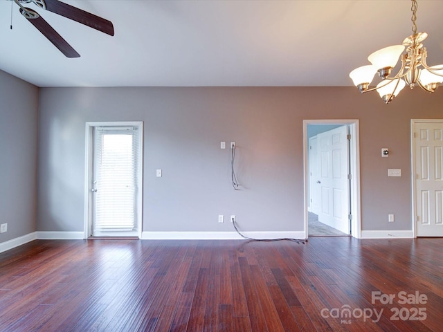 1000 E Woodlawn Rd Unit 402, Charlotte, NC 28209 - unfurnished living room featuring baseboards, ceiling fan with notable chandelier, and wood finished floors