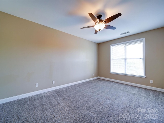 1000 E Woodlawn Rd Unit 402, Charlotte, NC 28209 - carpeted spare room featuring baseboards, a ceiling fan, and visible vents