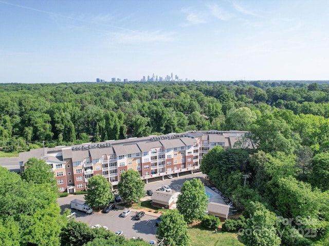 1000 E Woodlawn Rd Unit 402, Charlotte, NC 28209 - aerial view featuring a wooded view