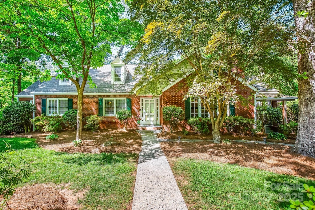 3275 Nottingham Rd, Winston Salem, NC 27104 - cape cod-style house with brick siding