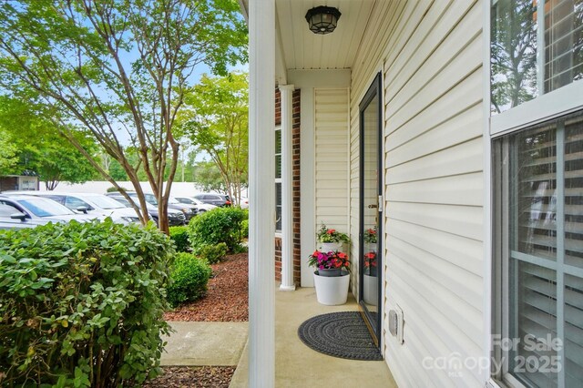 view of exterior entry featuring uncovered parking