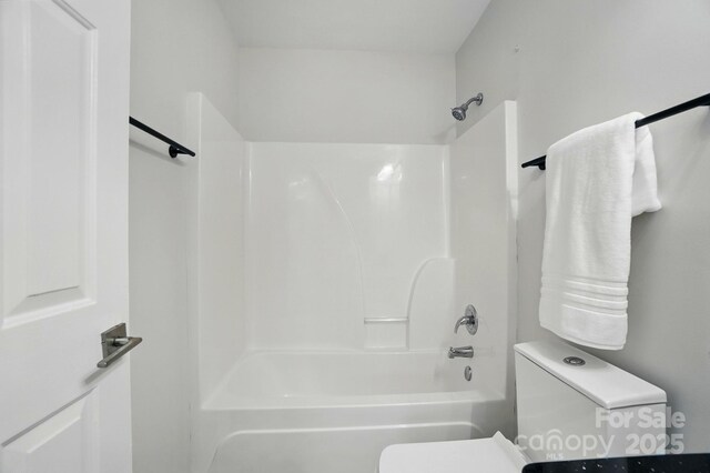 full bath featuring toilet and shower / bathing tub combination