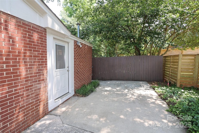 view of patio / terrace featuring fence
