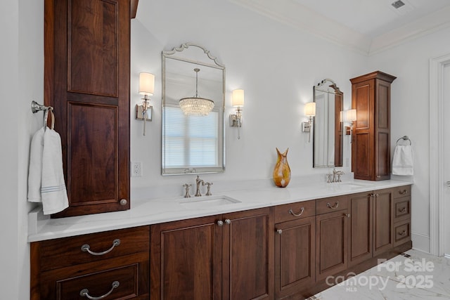 full bathroom featuring double vanity, crown molding, and a sink