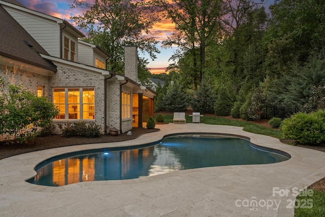 outdoor pool with a patio