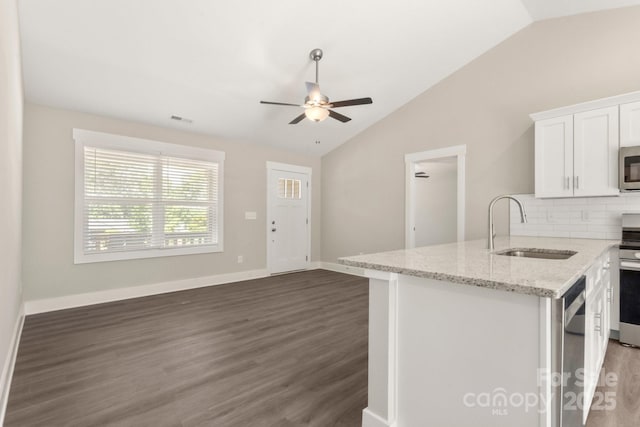 438 Forest Lake Rd, Forest City, NC 28043 - kitchen with white cabinets, ceiling fan, a sink, stainless steel appliances, and vaulted ceiling