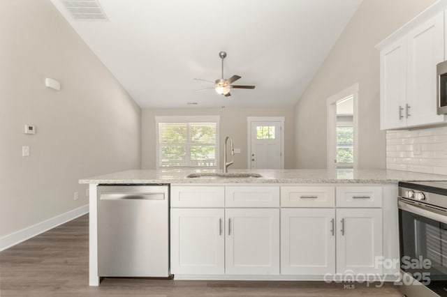 438 Forest Lake Rd, Forest City, NC 28043 - kitchen featuring ceiling fan, a sink, white cabinets, lofted ceiling, and stainless steel appliances