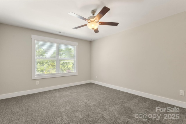 438 Forest Lake Rd, Forest City, NC 28043 - unfurnished room featuring baseboards, ceiling fan, dark colored carpet, and visible vents