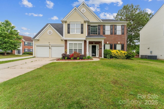 view of front of house featuring an attached garage, central AC, concrete driveway, a front lawn, and brick siding