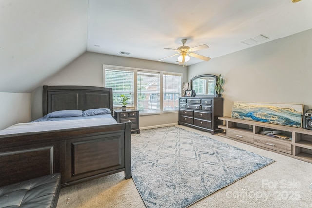 bedroom featuring lofted ceiling, ceiling fan, light carpet, and visible vents
