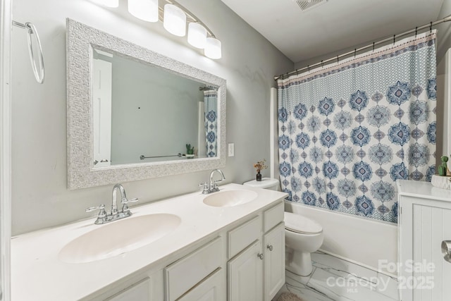 bathroom featuring toilet, double vanity, a sink, and shower / bathtub combination with curtain