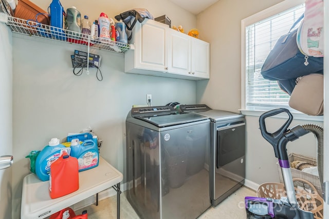 laundry area featuring cabinet space and independent washer and dryer