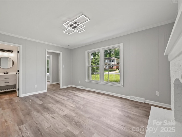 2544 Cedarwild Rd, Charlotte, NC 28212 - unfurnished living room with visible vents, ornamental molding, and wood finished floors