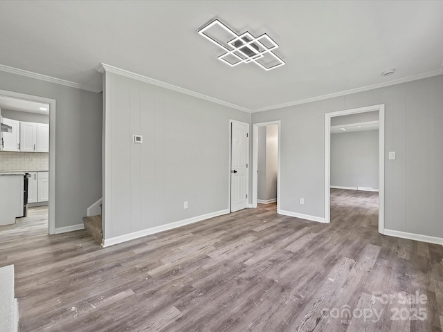 2544 Cedarwild Rd, Charlotte, NC 28212 - unfurnished living room featuring crown molding, baseboards, stairs, and wood finished floors