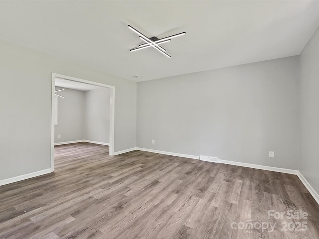 2544 Cedarwild Rd, Charlotte, NC 28212 - empty room with baseboards, wood finished floors, and visible vents